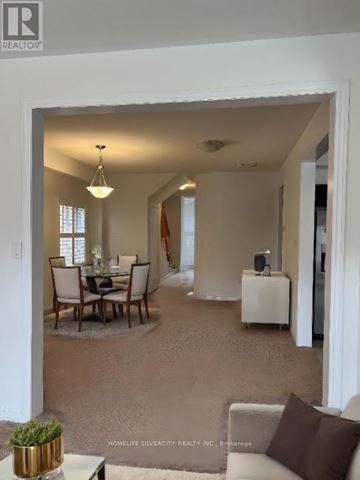 Southgate apartment for rent - A living room with a dining table and chairs.