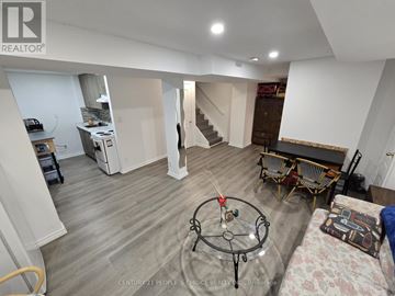 Mississauga (East Credit) apartment for rent - A living room with a glass table and a sofa.