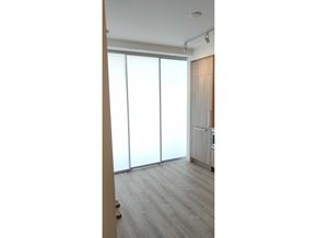 Surrey apartment for rent - A room with a sliding door and a radiator.