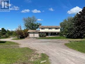 Uxbridge apartment for rent - A large house with a driveway in front of it.