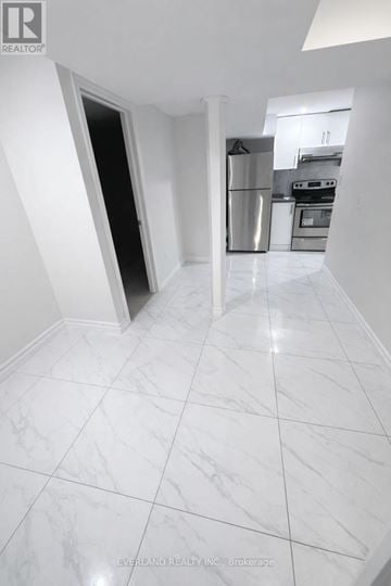 Toronto (Agincourt South-Malvern West) apartment for rent - A kitchen with white marble flooring and a stainless steel refrigerator.
