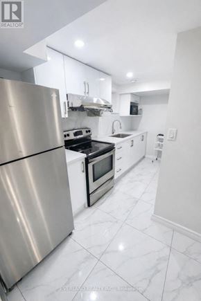 Toronto (Agincourt South-Malvern West) apartment for rent - A modern kitchen with a stainless steel refrigerator.