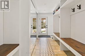 Clearview apartment for rent - A hallway with a tiled floor and a bench on the right side.