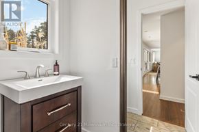 Clearview apartment for rent - A bathroom with a sink, mirror, and a window.