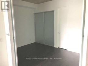 Toronto (Waterfront Communities) condo for rent - A room with a sliding door and a white wall.