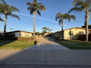 Imperial Beach apartment for rent - A residential street lined with palm trees.