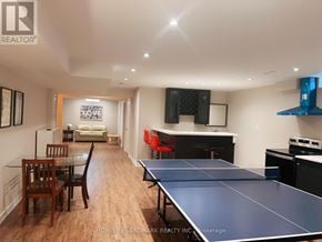 Markham (Victoria Square) apartment for rent - A ping pong table is in the middle of a living room.