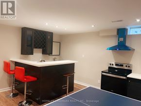 Markham (Victoria Square) apartment for rent - A black bar with red stools and a white counter.