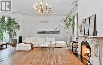 Toronto (Cabbagetown-South St. James Town) apartment for rent - A living room with a fireplace and a large painting on the wall.