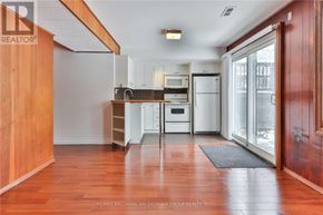 Toronto (Newtonbrook West) apartment for rent - A kitchen with white appliances and wooden floors.