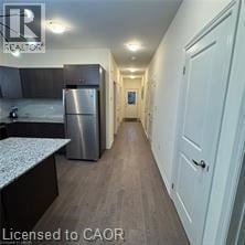 Atwood townhouse for rent - A kitchen with a refrigerator and a counter top.