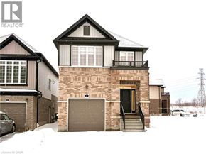 Kitchener apartment for rent - A house with a brown garage door is in front of a house with a black garage door.