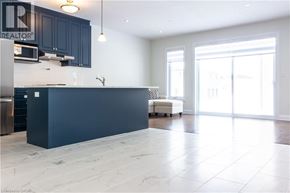 Kitchener apartment for rent - A kitchen with a large island in the middle.