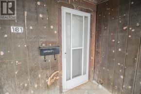 Port Colborne (East Village) multi-family for rent - A door with a glass panel and a sign that says "LOWER A".