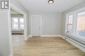 Port Colborne (East Village) multi-family for rent - A room with a white door and a window with a white frame.