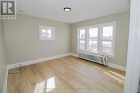 Port Colborne (East Village) multi-family for rent - A room with a window and a radiator on the floor.