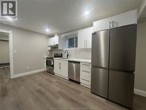 Windsor apartment for rent - A kitchen with a refrigerator, stove, and sink.