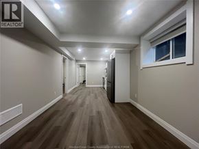 Windsor apartment for rent - A long hallway with wood floors and white walls.