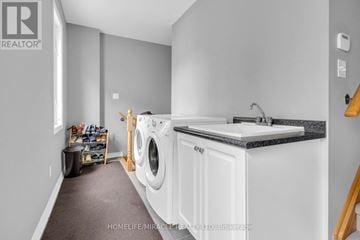 Wasaga Beach apartment for rent - A kitchen with a sink and a window overlooking the ocean.