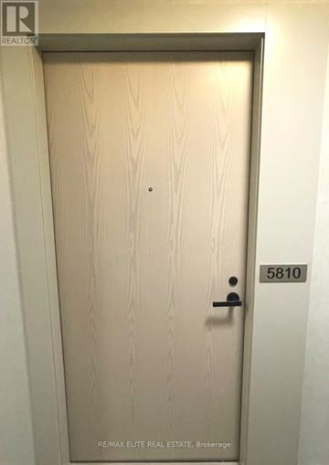 Vaughan (Vaughan Corporate Centre) condo for rent - A modern kitchen with white cabinets and stainless steel appliances.