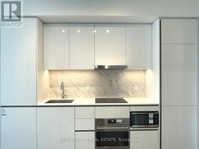 Vaughan (Vaughan Corporate Centre) condo for rent - A white bathroom with a glass shower stall and a toilet.
