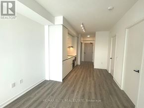 Vaughan (Vaughan Corporate Centre) condo for rent - A room with a wooden floor and white walls.