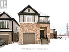 Kitchener apartment for rent - A house with a car parked in front of it.
