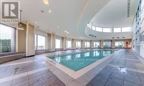 Toronto (Woburn) condo for rent - A large indoor swimming pool in a spacious room.