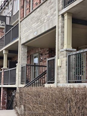 Kitchener townhouse for rent - A building with a balcony and a staircase.