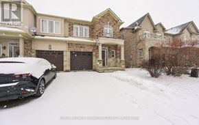 Hamilton (Stoney Creek Mountain) townhouse for rent - A black car is parked in front of a house with snow on the ground.