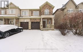 Hamilton (Stoney Creek Mountain) townhouse for rent - A snow-covered house with a car parked in front.