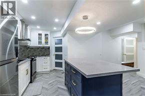 Hamilton apartment for rent - A modern kitchen with a large island and stainless steel appliances.