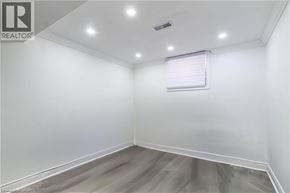 Hamilton apartment for rent - A room with a window and a wooden floor.