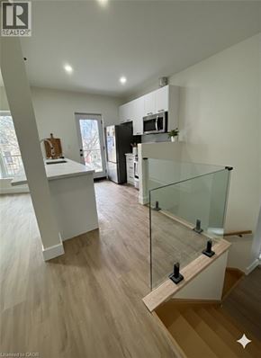 Hamilton apartment for rent - A modern kitchen with a glass railing.