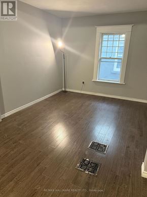 Welland (Welland Downtown) multi-family for rent - A room with a window and a floor drain.