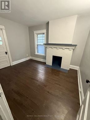 Welland (Welland Downtown) multi-family for rent - A room with a fireplace and a window.