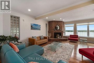 Ottawa apartment for rent - A living room with a fireplace and a painting on the wall.