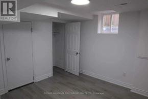 Pickering (Brock Ridge) apartment for rent - A white door is in a room with a window.