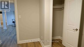 Toronto (Morningside) apartment for rent - A room with a white door and a chair in it.