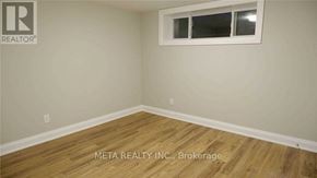 Toronto (Morningside) apartment for rent - A room with a window and wooden flooring.