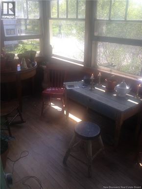 Moncton apartment for rent - A room with a table and a chair in it.