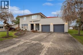 Fort Erie apartment for rent - A house with a driveway in front of it.