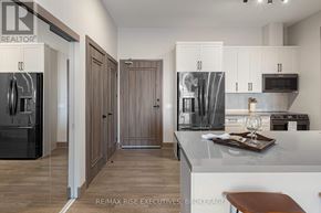 Kingston (City Northwest) condo for rent - A modern kitchen with a bar stool in front of it.