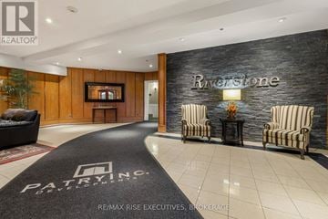 Kingston (East Gardiners Rd) condo for rent - A living room with a black carpet that says "PATRYNCE" on it.