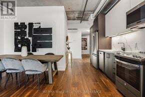 Ottawa condo for rent - A modern kitchen with a dining table and chairs.