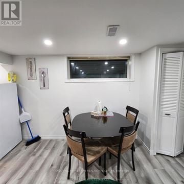 Barrie (Grove East) apartment for rent - A dining room with a table and chairs.
