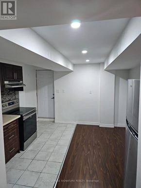 Ajax (Northwest Ajax) apartment for rent - A kitchen with white walls and a wooden floor.