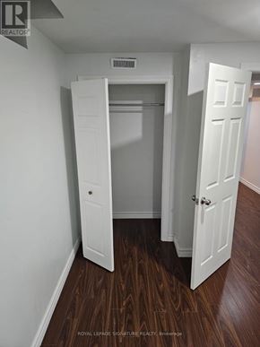 Ajax (Northwest Ajax) apartment for rent - A white door is open to a room with wood flooring.