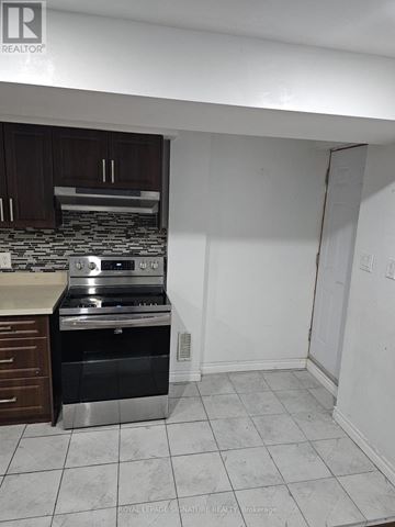 Ajax (Northwest Ajax) apartment for rent - A kitchen with a stove top oven and a microwave.