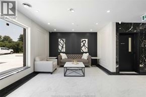 Windsor condo for rent - A modern living room with a black and white color scheme.